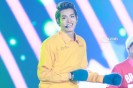 Kris in a yellow shirt with green gloves